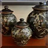 P05. 4 Pottery glazed 2 tone w/floral design ginger jars in varying heights. 14”h, 12”h, 10”h and 8”h - $150,145,125,85 